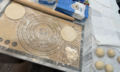 Lebanese Pita Dough Partially Rolled.png